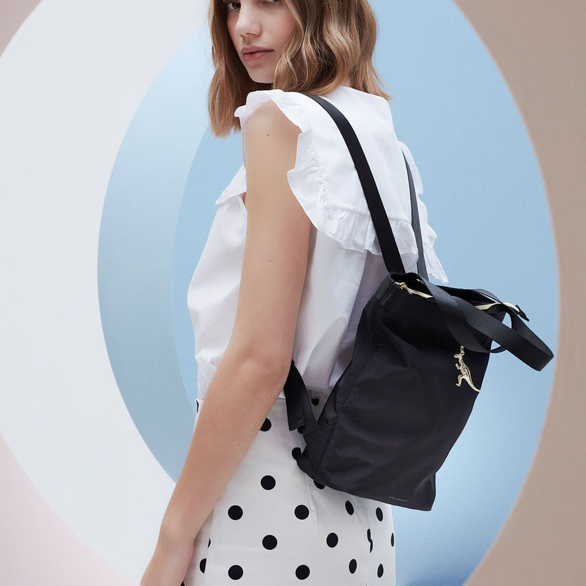 Estella Bartlett Tote Backpack - Black Nylon With Gold Dinosaur Charm - Ebp3925